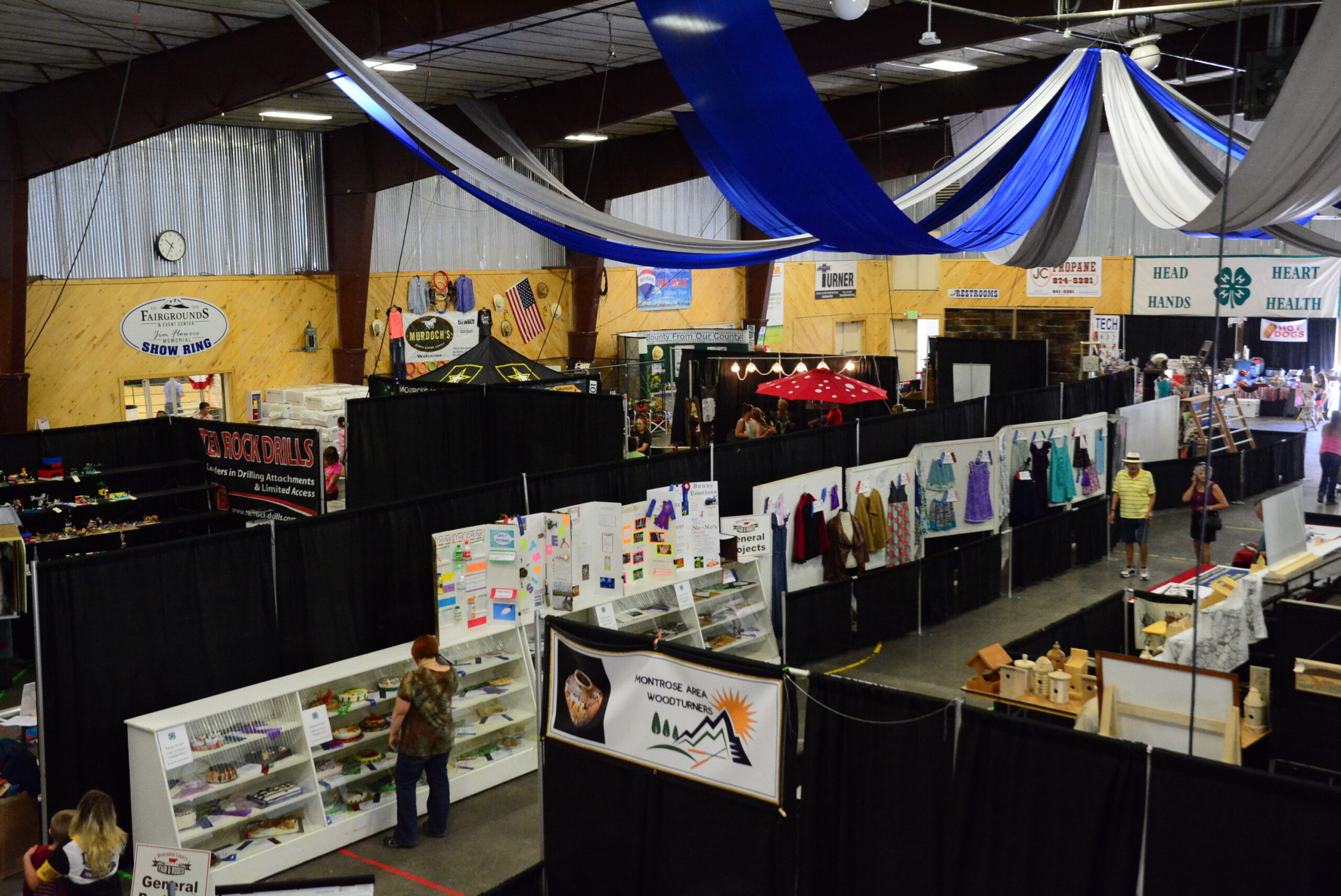 friendship hall set up at fair with booths of displays
